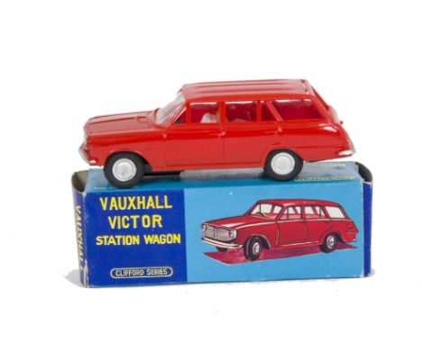 A Clifford Series (Hong Kong) Friction Drive Vauxhall Victor Estate, red plastic body, silver trim and hubs, three suitcases,