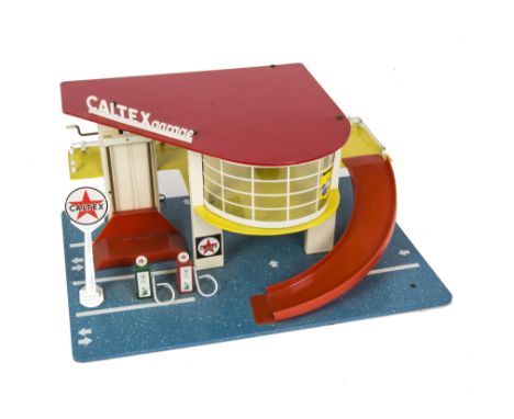 A Sio (Holland) 1960s Caltex Garage, of plywood and plastic construction, 'Caltex' petrol pumps and signs, lift and battery o