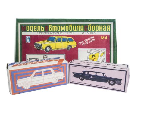 USSR Plastic Battery-Operated Zaz 968, yellow body, red interior, in original box, with similar battery-operated Yanka, red b