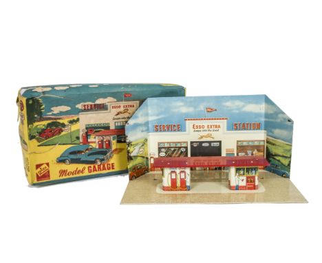A Codeg Tinplate Model Garage & Forecourt, with scenic backdrop depicting Esso Extra Service Station, forecourt with Esso pet