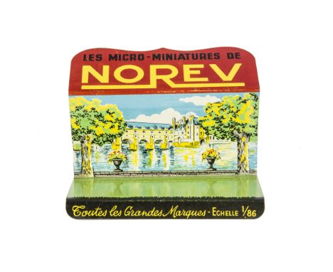 A Norev Tinplate Shop Counter Display Stand, with riverside scene, for 1/86 scale Norev plastic vehicles, height 100mm, width