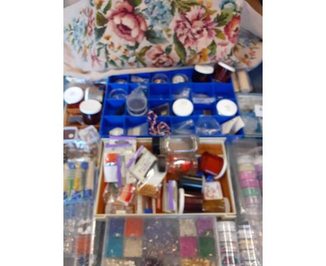 A quantity of knitting and craft related items to include mixed wool, a tapestry, knitting needles, beads, sequins and a tape