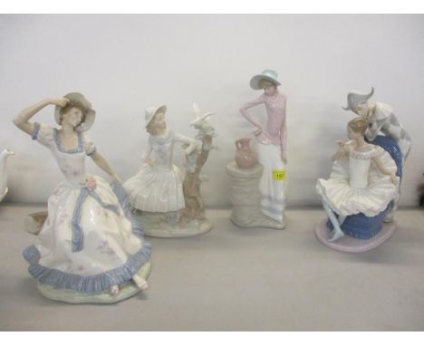 A group of four large Nao porcelain figurines to include one of a Harlequin talking to a young ballerina seated in a chair ho