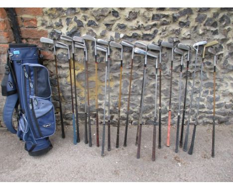 Twenty vintage steel shafted golf putters in a blue canvas bag together with clocks to include a late 19th century black slat