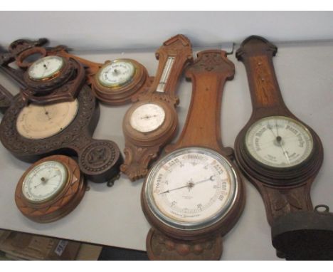 A selection of mainly early 20th century barometers to include an oak carved Aneroid barometer a/FLocation: 