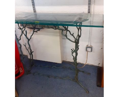 A green patinated metal console table of twig design with three glass tops of various sizesLocation: 