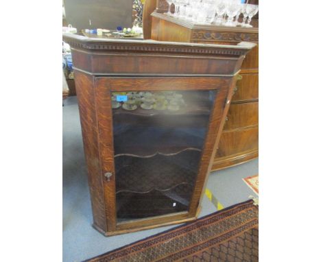 A Georgian oak wall hanging corner cabinet with a dental moulded cornice and single door, 105cm h x 73cm w, together with six