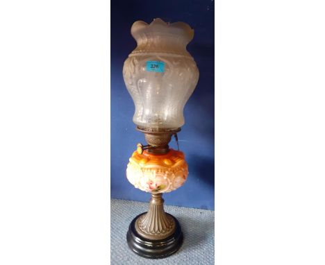 A Victorian oil lamp having a floral painted and peach glass reservoir and an etched glass shade, 57cm high, Condition: Shade