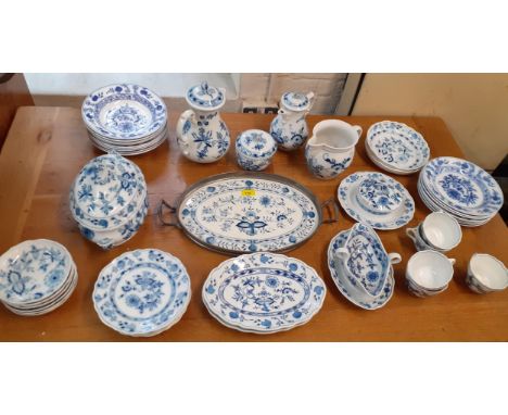 A Meissen blue and white onion pattern dinner service comprising approx 31 pieces, along with a matching Delft ceramic and me