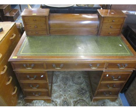 A yew wood twin pedestal writing desk with inset leather scriber, one long drawer flanked by two short frieze drawers, pedest