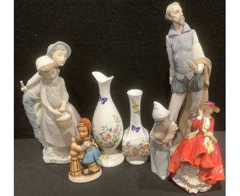 A Nao figure group, courting couple; another, Quixote Reading; a Royal Doulton figure, Top O'The Hill HN 1834; a Lladro figur