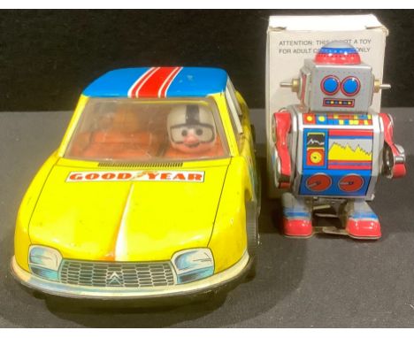 A clockwork car with remnants of a box; a clockwork robot, boxed (2)