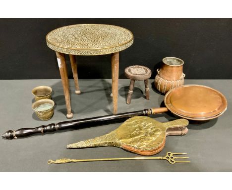 A Middle Eastern circular brass top table, embossed with script, 38cm high, 38cm diameter, early 20th century; a pair of Chin