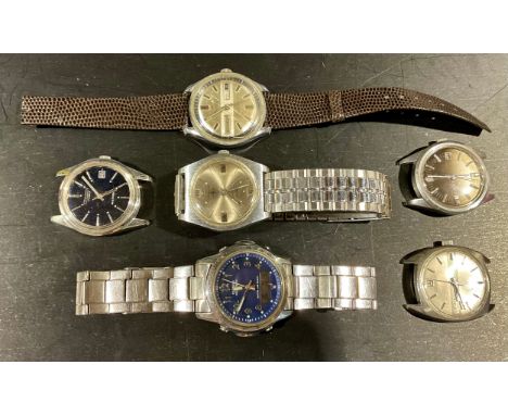 A selection of wristwatches and watch facesthe three wristwatches include an Orion day-date calendar, a Casio wave cepter WVA