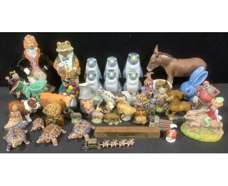 A Beswick model donkey, a calf and a bulldog; a set of four Royal Doulton miniature figures, Falstaff, Jester, Town Crier and