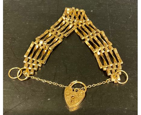 A 9ct gold gate bracelet, tapers from approx. 5mm-1.6cm's wide, stamped "375", heart shaped padlock fastening, stamped "9 375