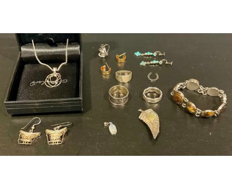 A selection of silver, unmarked white metal and costume jewellery,to include a Landstroms's Black Hills 10K gold and silver r
