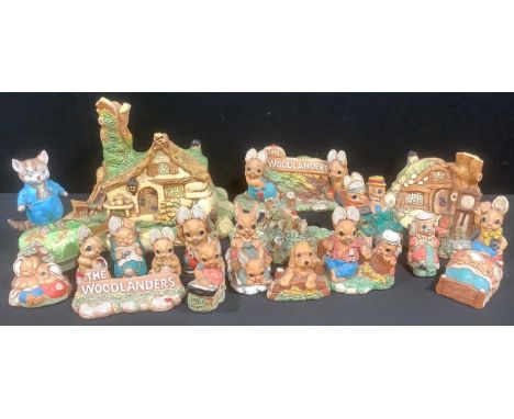 The Woodlanders - a collection of novelty rabbit characters, houses, motorcar, sledge, puppy, a name stand, qty; a Tom Kitten