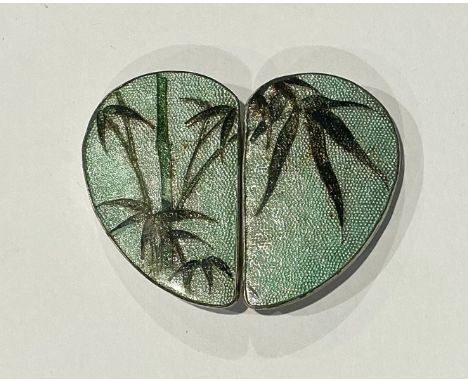 A Japanese Meiji heart shaped cloisonné styled buckle, displaying bamboo tree in blossom on a graceful green textured manner 