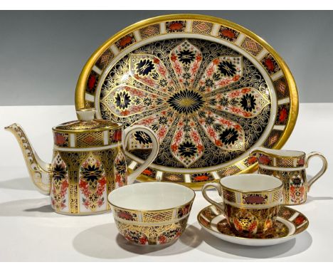 Royal Crown Derby - an 1128 old Imari miniature bachelors tea set on oval tray, comprising teapot, milk jug, sugar bowl, cup,