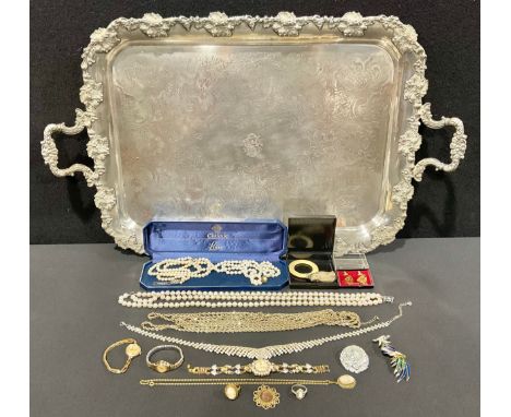 A large silver silver plated tray, cast with fruiting grape vines,rolled gold cased wristwatch, others gold plated, lotus and
