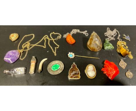 A selection of jewellery,to include quartz and agate tumbled stone pendants, three with costume necklaces, a carved nephrite 