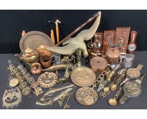 A large brass heavy gauge model of an eagle; other copper and brass ware, copper kettle, copper pan; brass tea kettle; a fold