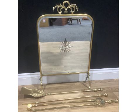 A set of George III style brass fire irons, the shovel 72cm long; a brass fire screen, star cut mirror plate (2)