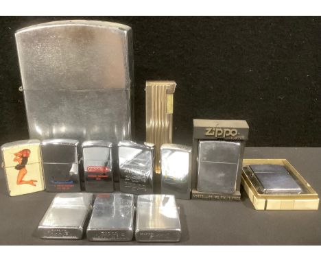 Cigarette Lighters - a collection of nine Zippo lighters, some boxed; a large novelty table lighter, modelled in the style of