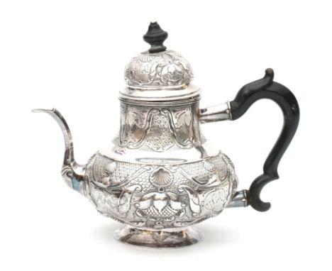  A Dutch silver teapot. With a wooden handle and knob. Hallmarked Haarlem. Maker's mark Paulus Vermeulen. Year letter (Y) 175