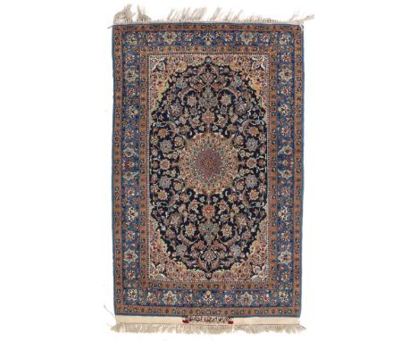  An Eastern tapestry with centrally a medaillon in blue, green and red, Isfahan. Afm: Lx170 Bx110 cm.
