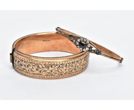 TWO ROLLED GOLD BANGLES, the first a wide bangle, decorated with an engraved floral design, fitted with a push pin clasp, sta