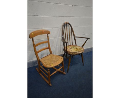 AN ERCOL MODEL 365A QUAKER BACK ARM CHAIR, and a beech rocking chair with a cane seat (2)