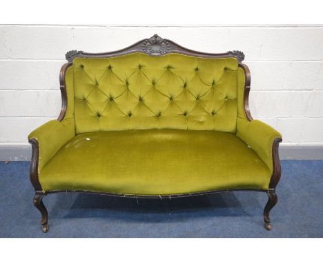 A 20TH CENTURY FRENCH TWO SEATER SOFA, carved top rail to downward swept arms, buttoned back and green velvet upholstery, app