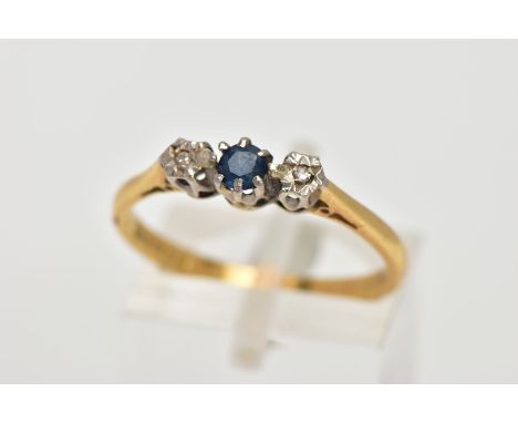 AN 18CT GOLD SAPPHIRE AND DIAMOND RING, designed with a central circular cut blue sapphire, flanked with illusion set single 