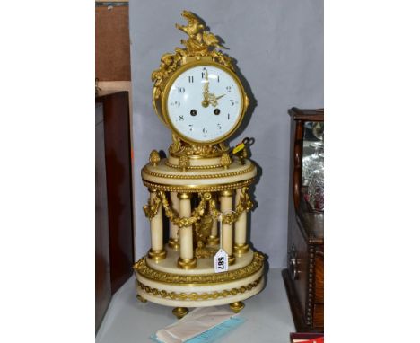 AN ORMOLU AND WHITE MARBLE FRENCH MANTLE CLOCK, circa 1890, the drum case is surmounted by a birds on a nest, the case is sup