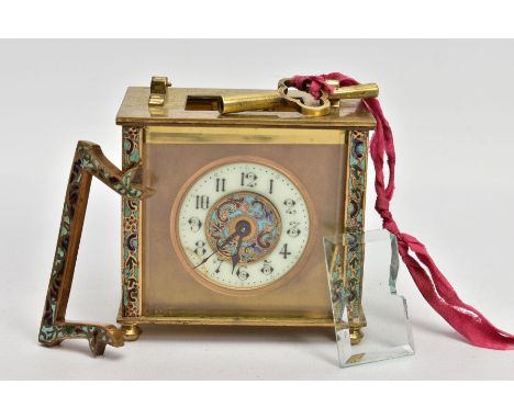 A BRASS AND ENAMELLED CARRIAGE CLOCK, of a square form, round white dial with the centre decorated with a blue enamel, Arabic