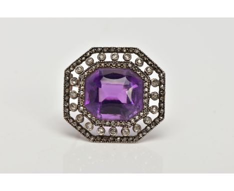 A LATE VICTORIAN AMETHYST AND ROSE CUT DIAMOND BROOCH, centring on a cushion cut amethyst, within an openwork rose cut diamon