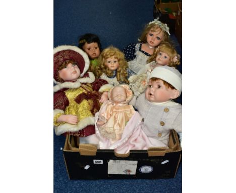 A BOX OF COLLECTORS DOLLS, to include seven dolls, a heavy porcelain soft bodied baby doll marked SFC, length 53cm (hair loos