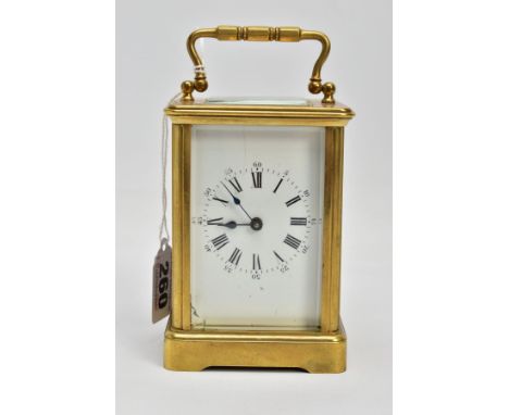 A BRASS CARRIAGE CLOCK, white dial, Roman numerals, blue hands, within a five glass panel surround, stamped to the base 1470,