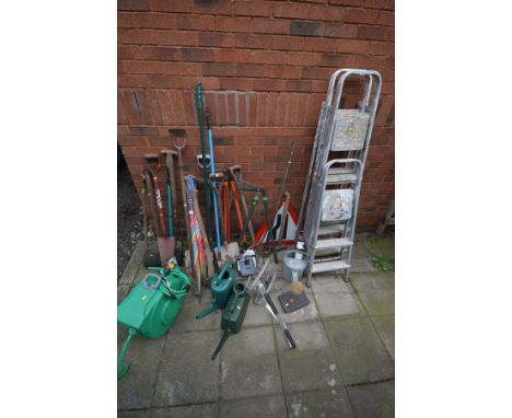 THREE ALUMINIUM STEP LADDERS together with a ladder stand-off, quantity of garden tools to include spades, forks, rake etc, a
