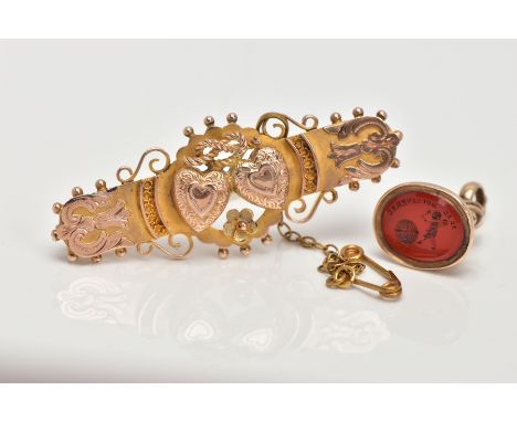 A 9CT GOLD VICTORIAN SWEETHEART BROOCH AND A YELLOW METAL INTAGLIO FOB SEAL, the brooch decorated with two hearts, rope knot 