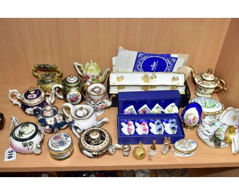 A COLLECTION OF TEN RESIN MINIATURE TEAPOTS, SWAROVSKI CRYSTAL AND OTHER DECORATIVE ITEMS, including Aynsley place name/menu 