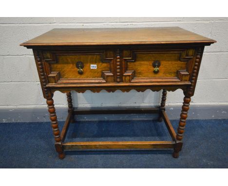 AN OAK SIDE TABLE, two drawers with geometric detail, on bobbin turned legs united by a box stretcher, width 92cm x depth 51c