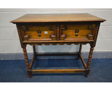 AN OAK SIDE TABLE, two drawers with geometric detail, on bobbin turned legs united by a box stretcher, width 92cm x depth 51c