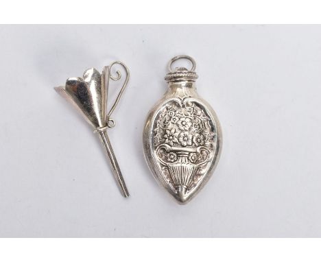 A WHITE METAL SCENT BOTTLE WITH FUNNEL, the bottle decorated with an embossed floral design, with a fitted screw lid fitted w