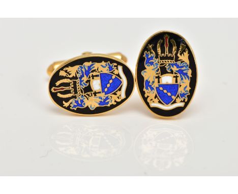 A PAIR OF 9CT GOLD ENAMELLED CUFFLINKS, each of an oval form, decorated with a black, blue, white and red enamelled crest, ha