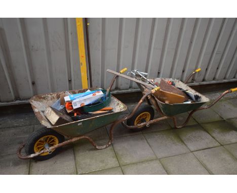 TWO WHEEL BARROWS containing tools including a Silverline double suction pad, spirit levels, plastering trowels etc