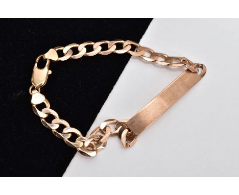 A 9CT GOLD IDENTIFICATION BRACELET, vacant identification panel, on a flat curb link bracelet fitted with a lobster claw clas