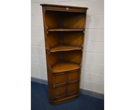 AN ERCOL ELM FREESTANDING CORNER CUPBOARD, with a single panelled cupboard door, width 76cm x depth 43cm x height 184cm